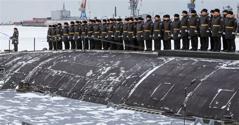 Putin visits a shipyard to oversee the commissioning of new Russian nuclear submarines